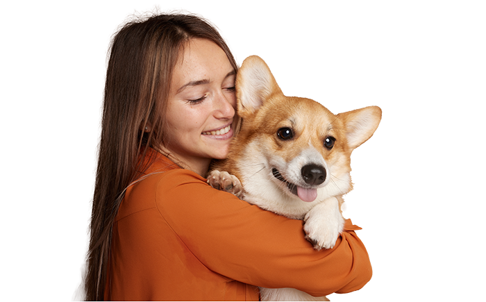 Hondenoppas knuffelt met Corgi hond