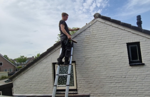 Schoorsteen verwijderen en muur terug metselen