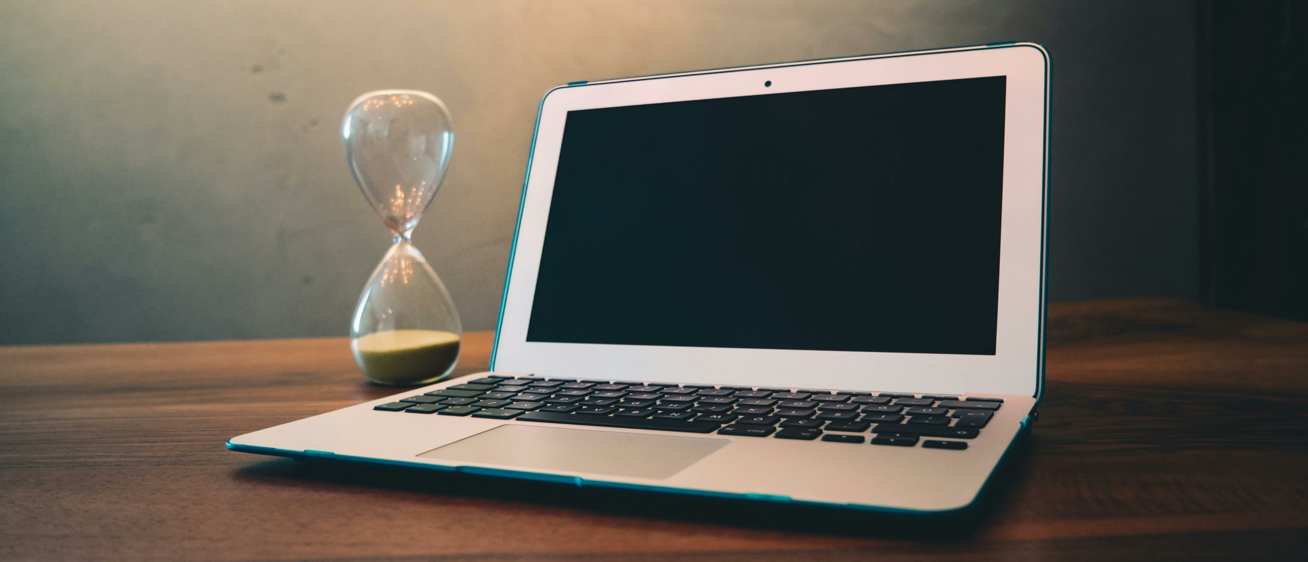 Laptop and Hourglass