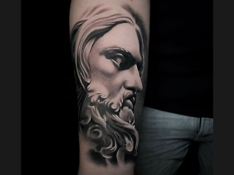 Realisme black and grey zeus tattoo