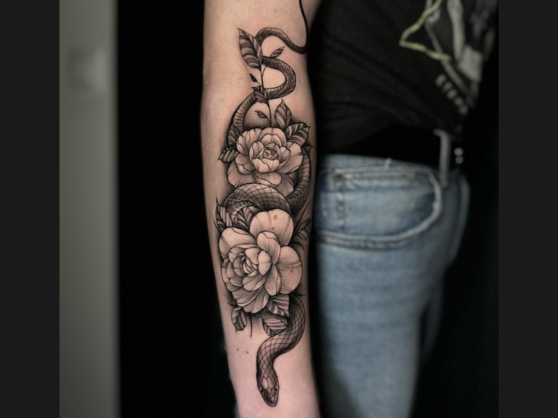 Floral snake tattoo fine line tattoo