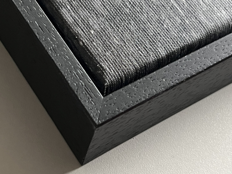 This piece is painted on canvas stretched over a wood panel rather than an aluminum frame, and is therefore delivered in a black box frame, included in the price.
