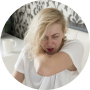 woman-sneezing-holding-her-glasses