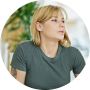 young-blonde-woman-sitting-table-looking-side-coffee-shop