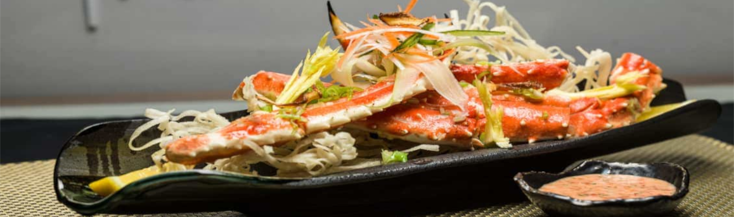 Elegant Aziatisch gerecht geserveerd in restaurant Tamarind op de Nieuw Statendam, met verfijnde presentatie en verse ingrediënten.