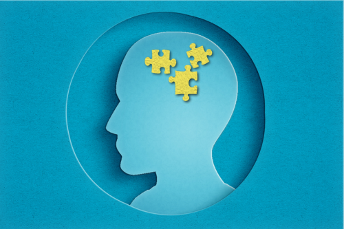Silhouet van een hoofd met 3 puzzelstukjes