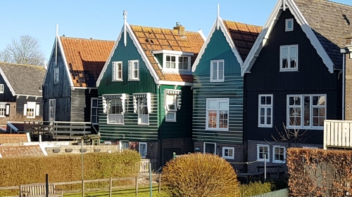 Authentic green and black wooden houses at Marken in Holland
