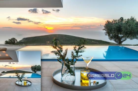 Villa met zwembad en uitzicht over de zee met zonsondergang en een cocktail - Geregeld24