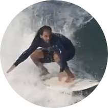 Surfer learning to improve on big waves  in surf camp Bali