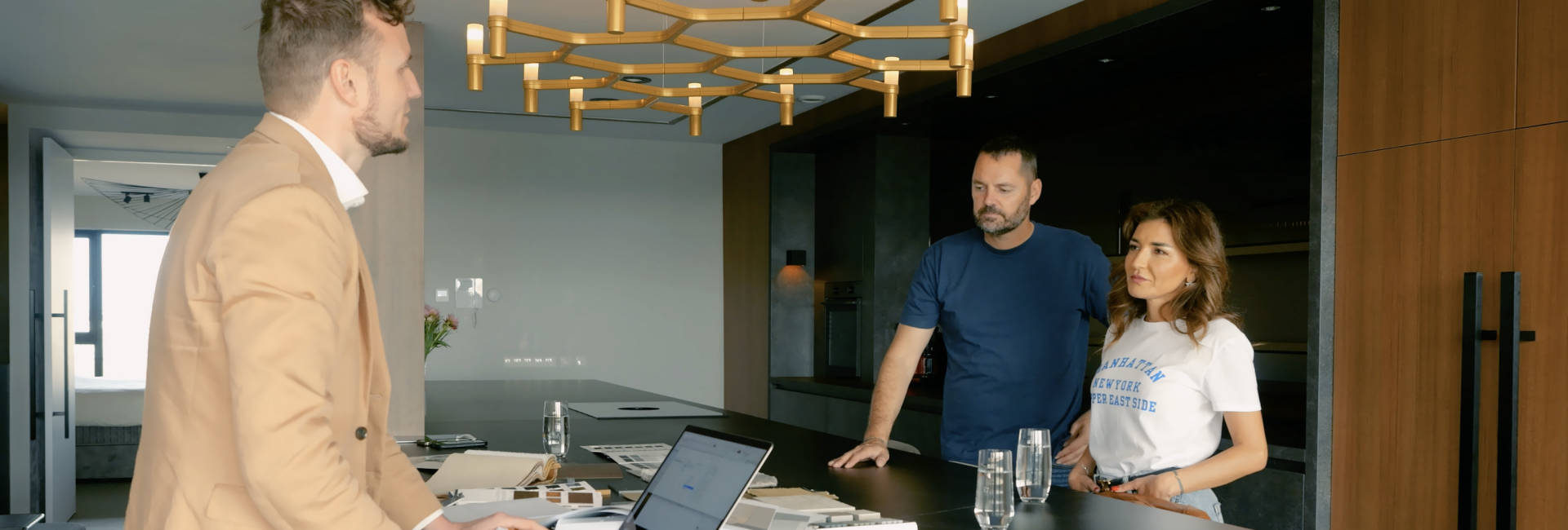 Interior designer leading natural client intake conversation in premium design studio