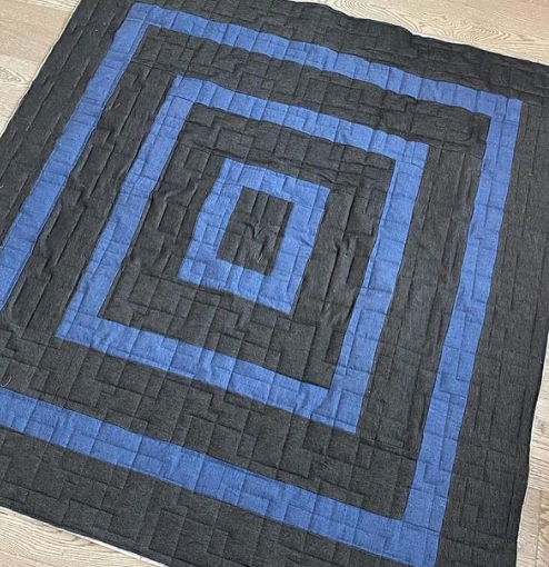 Denim quilt with light and dark demin in a square in square quilt pattern by prickly pear quilting