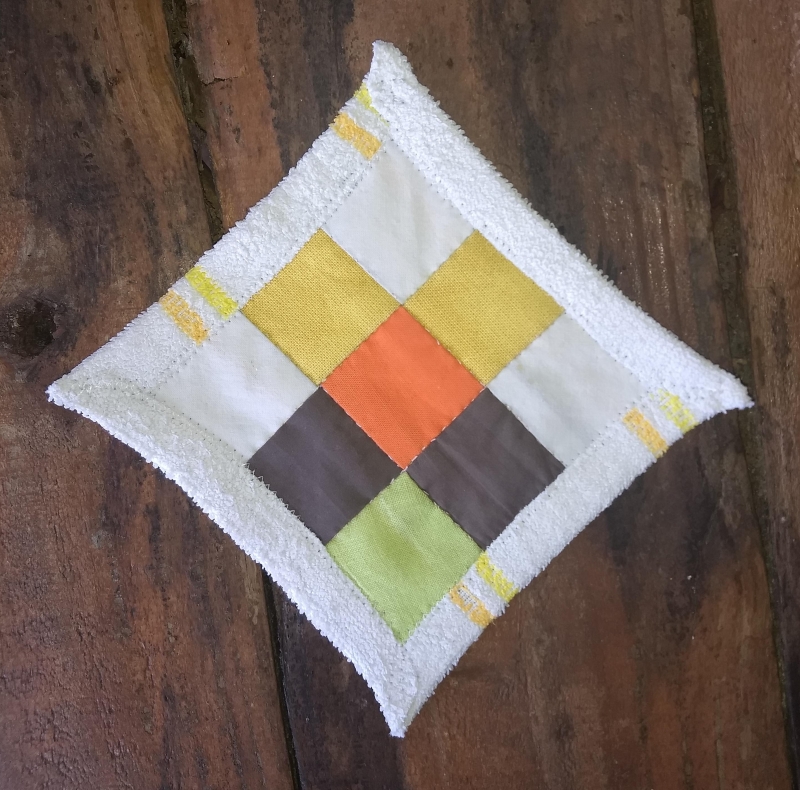 9 patch quilt block, made with yellow, white, orange, brown and green by Rianne from Kick Ass Quilts for the Comfort Blanket for Our Planet