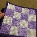 edna-quilt-front mini coaster made from grandchildren dresses with lessons kick ass quilt college in purple and white with bug fabric
