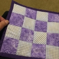 edna-quilt-front mini coaster made from grandchildren dresses with lessons kick ass quilt college in purple and white with bug fabric
