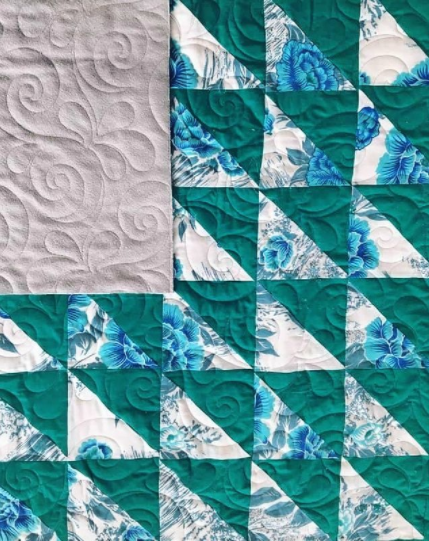 Triangles and flowers quilt green and blue  by prickly pear quilts with reclaimed fabrics