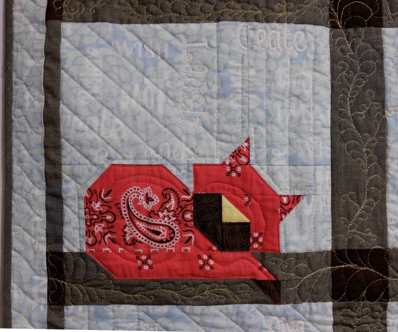 Baby memory quilt: Lying patchwork cat made from red handkerchiefs