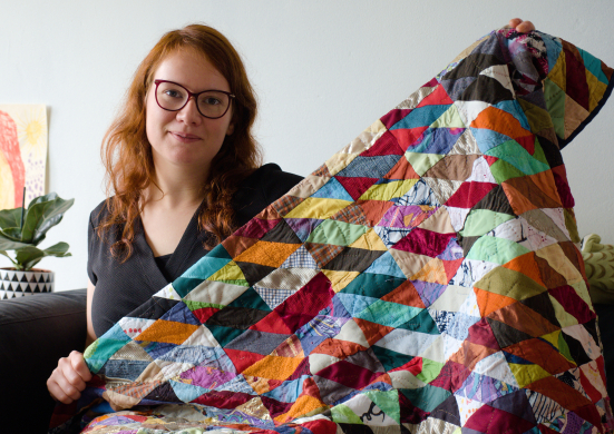 Rianne teacher of kick ass quilts showing of her first quilt made from scrap fabric Rianne teacher of kick ass quilts showing of her first quilt made from scrap fabric