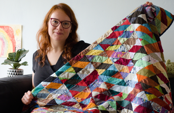 Rianne teacher of kick ass quilts showing of her first quilt made from scrap fabric