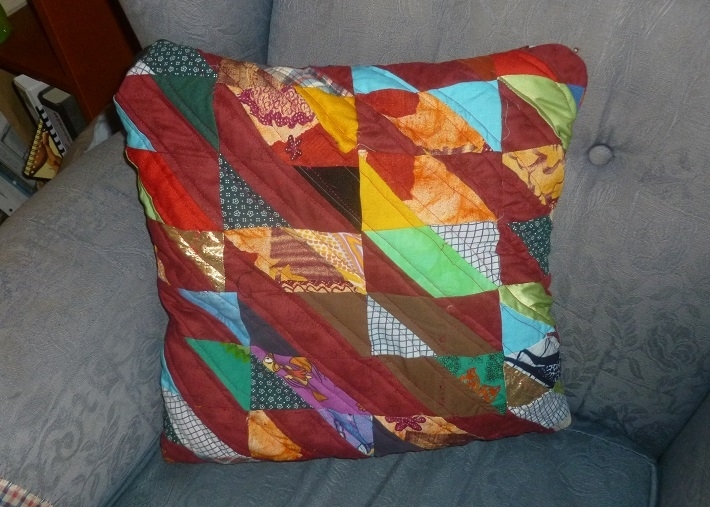 Scrap quilt pillow made from orphan blocks