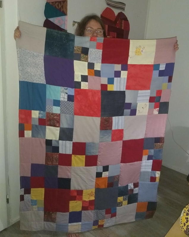 Sustainable Quilt welcome blanket made by Kick Ass Quilts students and with old clothes