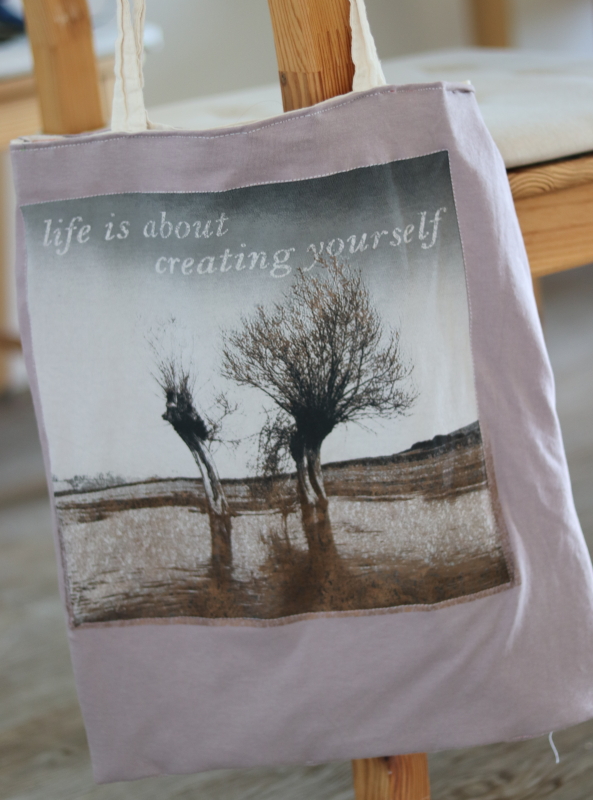 T-shirt tote bag 'life is about creating yourself'  background with trees in water landscape and light purple