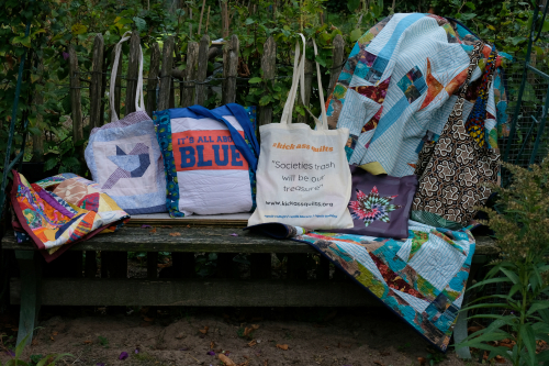Quilted bags together on a bench