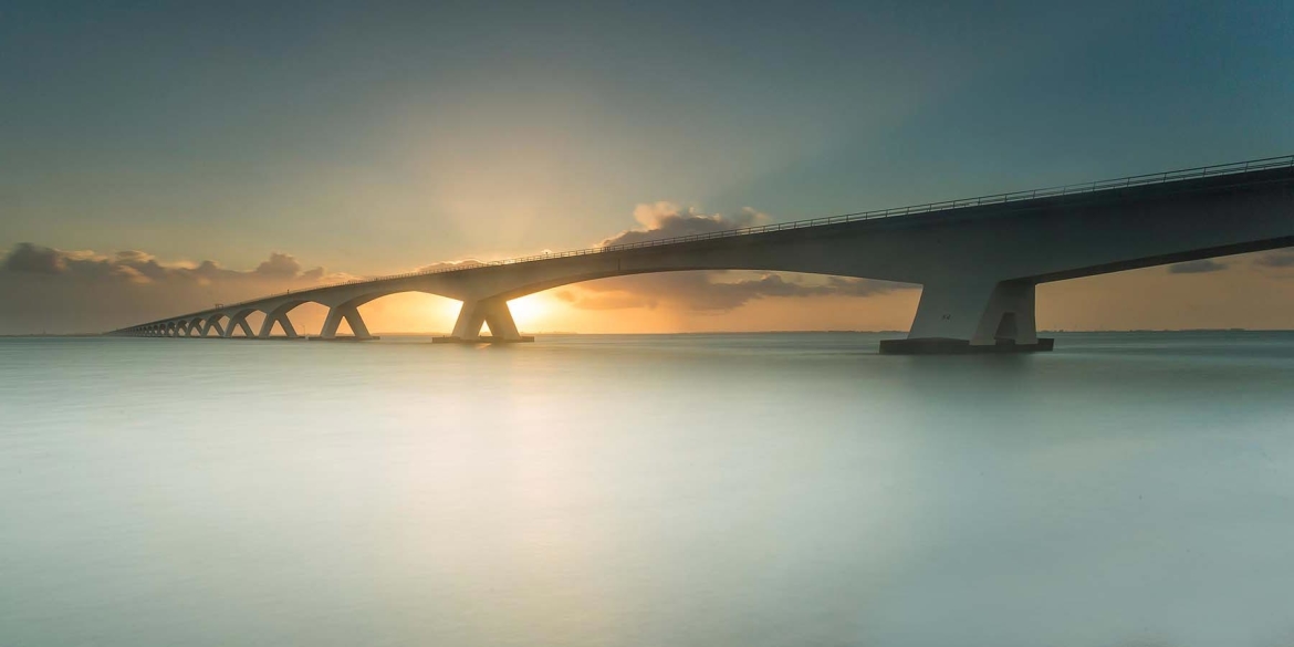 Long exposure sea bridge sunset