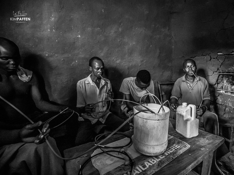 Men drinking in Rural Uganda near Sipi Falls