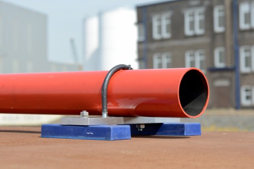 Two magnet anchors attached to a red pipe