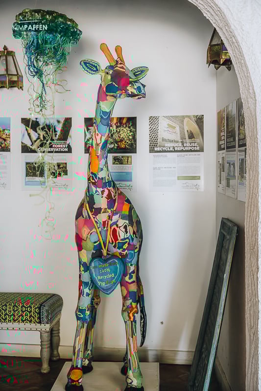Giraffe artwork made out of flipflop waste from the ocean