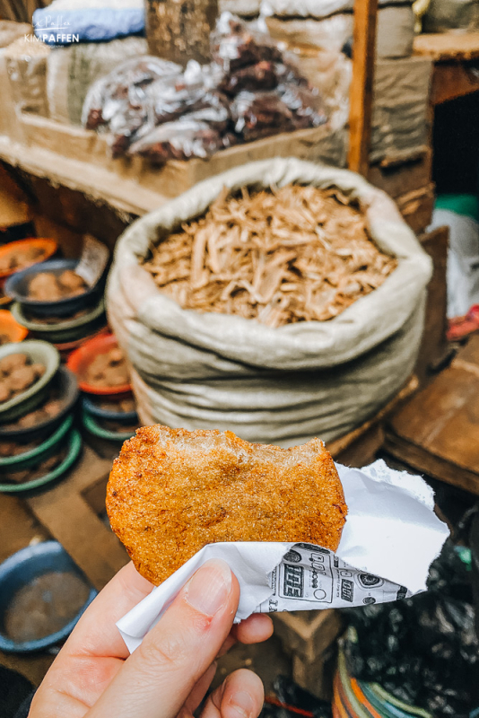 Taste banana pancakes on Kampala Markets