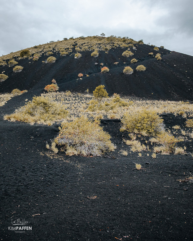 Looking up to the black colored Chaimu Volcanic Crater in Tsavo West National Park Kenya