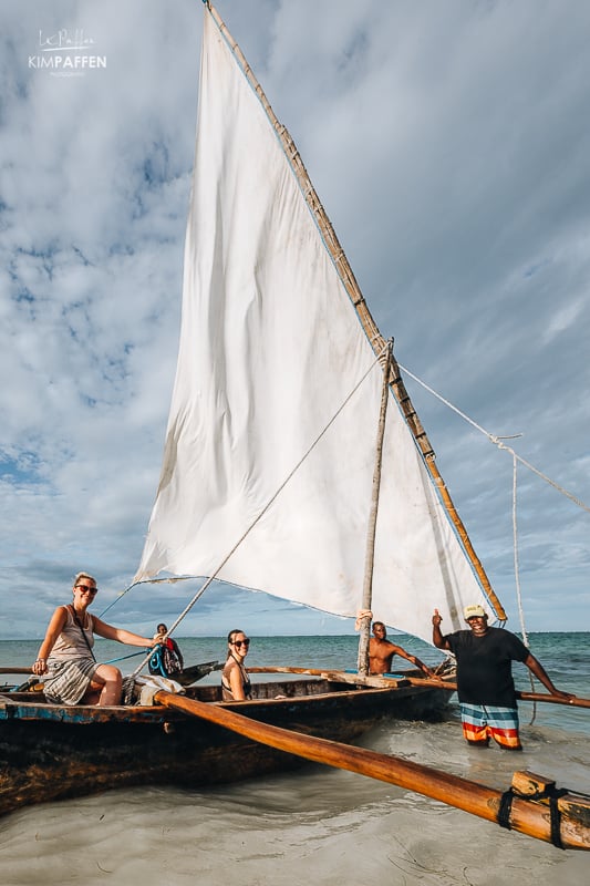 Guests enjoying beach walk, boat ride, and ocean views in Diani