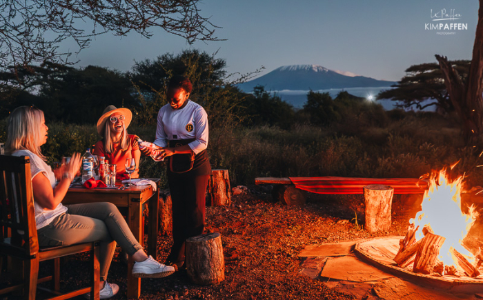 Dining under the stars with a camp fire at Oilepo Amboseli Dining under the stars with a camp fire at Oilepo Amboseli, with clear views of mount Kilimanjaro