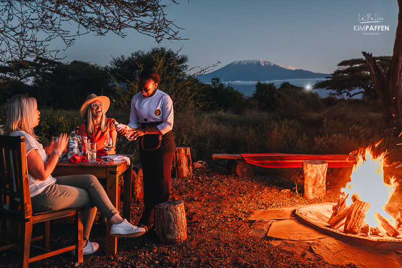 Dining under the stars with a camp fire at Oilepo Amboseli, with clear views of mount Kilimanjaro