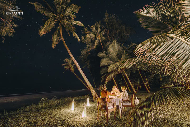 Staff member serving private birthday dinner in villa