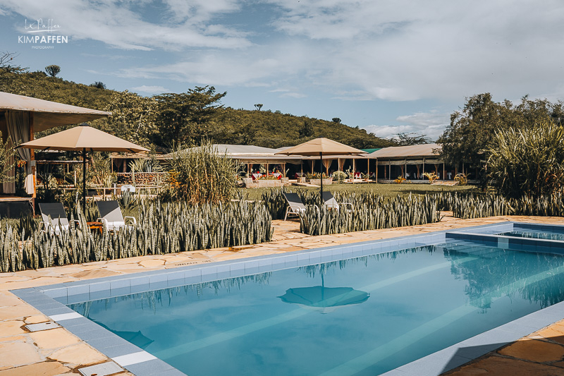 Relaxing in the large pool of Zebra Plains Mara Camp after safari in the Masai Mara National Reserve Kenya