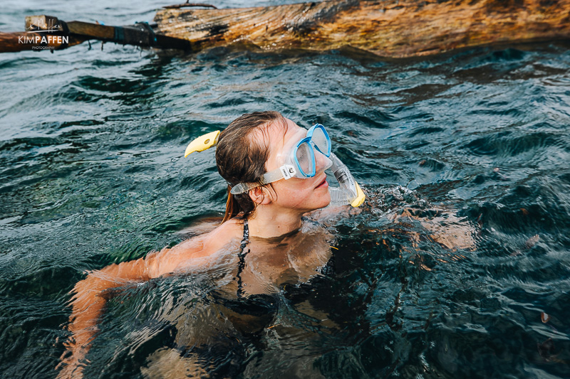 Tourist snorkeling in coral reef waters near Diani Beach