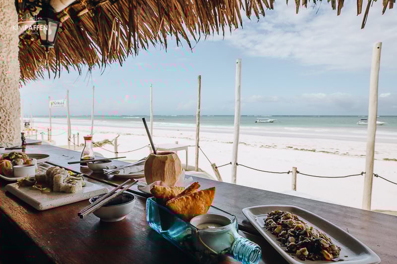 eating sushi at Nomad Beach Bar in Diani Beach with views of the Indian ocean