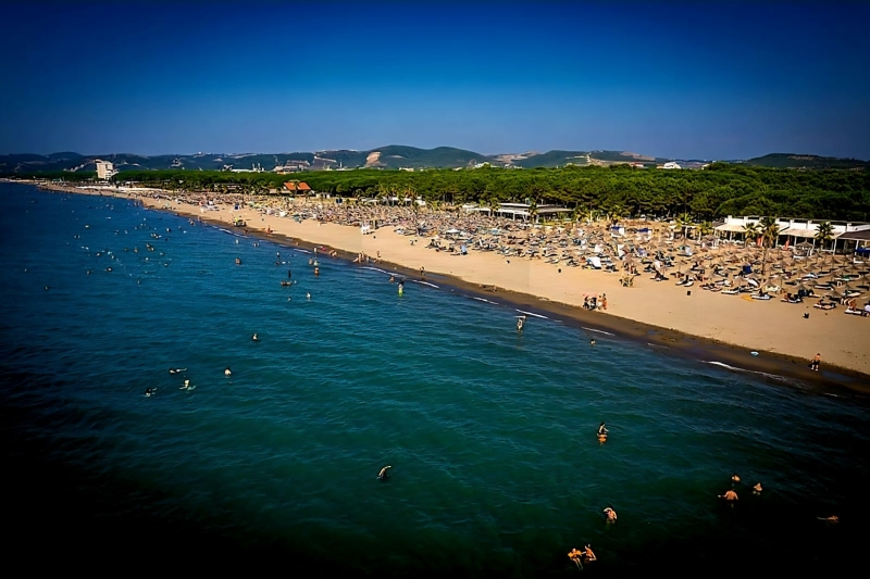 Spille Beach near Durrës, Albania, featuring a long sandy beach, pine forests and calm Adriatic waters. Perfect for visitors exploring the Durrës City Guide.