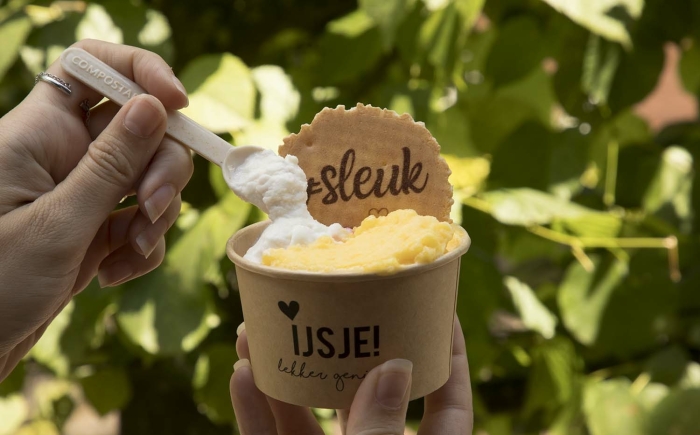 Someone showing ice cream with a compostable ice cream scoop