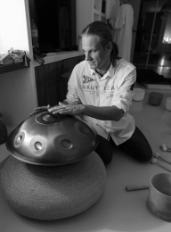playing handpan with intention sound healing