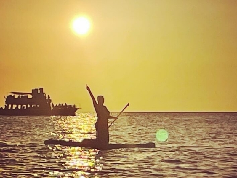 paddle board sunset