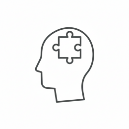 Icoon van een hoofd met een puzzelstuk, symbool voor het ondersteunen van beelddenkers met visuele leermethoden.