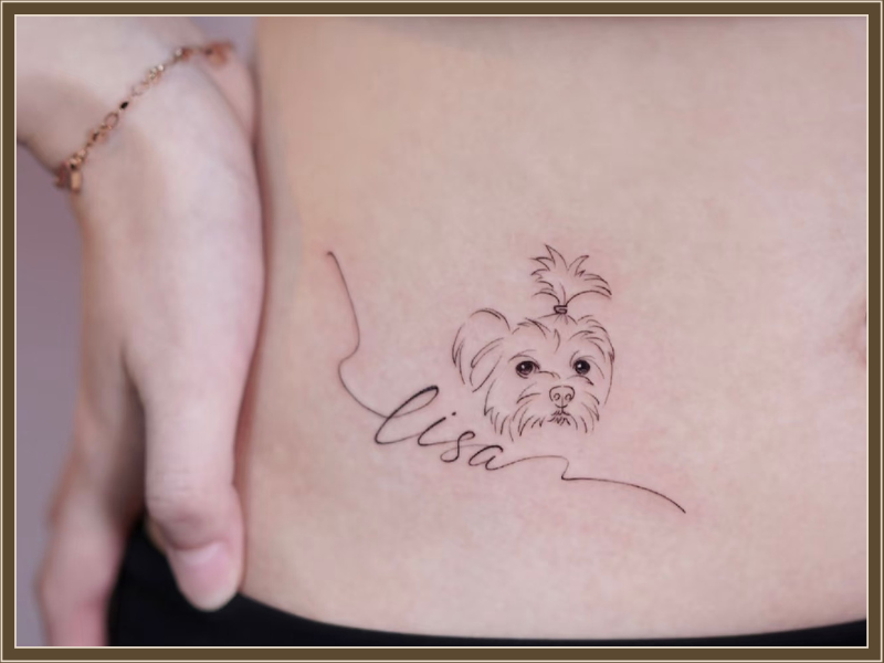 dog tattoo on stomach