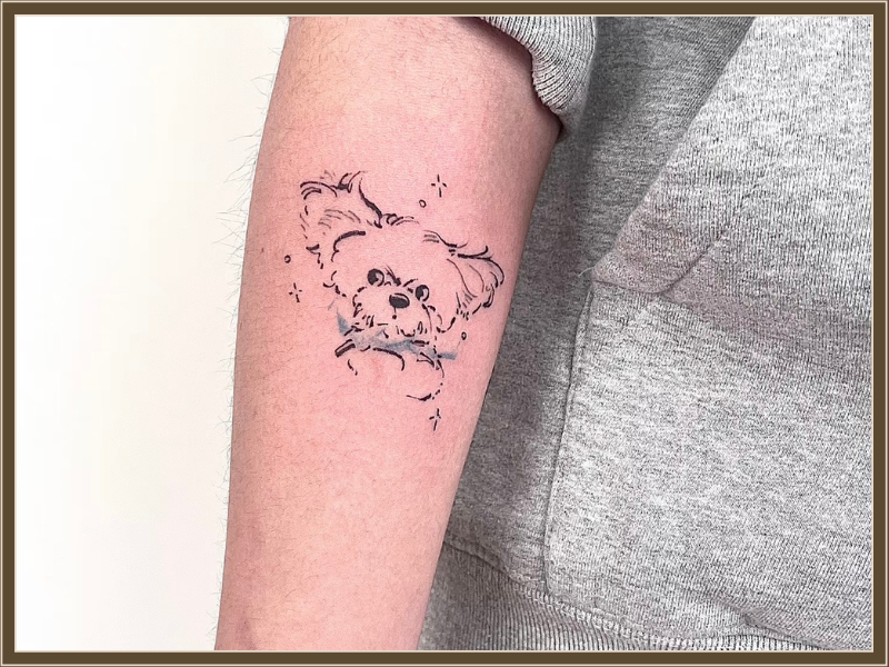 dog tattoo on arm