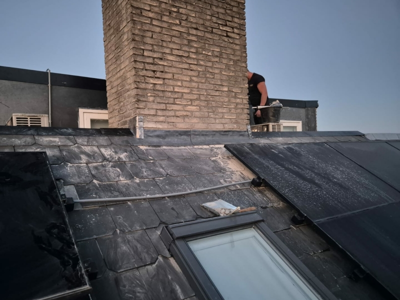 Schoorsteen op leien dak renoveren