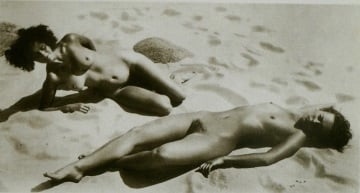 nude females lying on the beach
