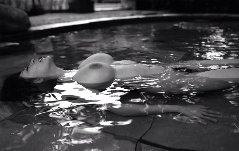 photo of nude female in the water