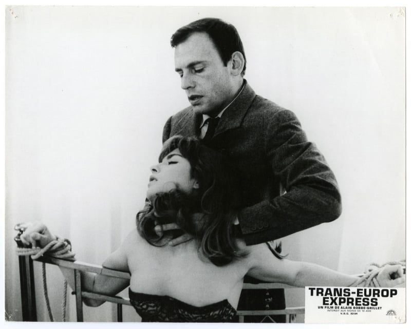 Press Photo of Trans-Europ Express, 1966 experimental film written and directed by Alain Robbe-Grillet and starring Jean-Louis Trintignant and Marie-France Pisier